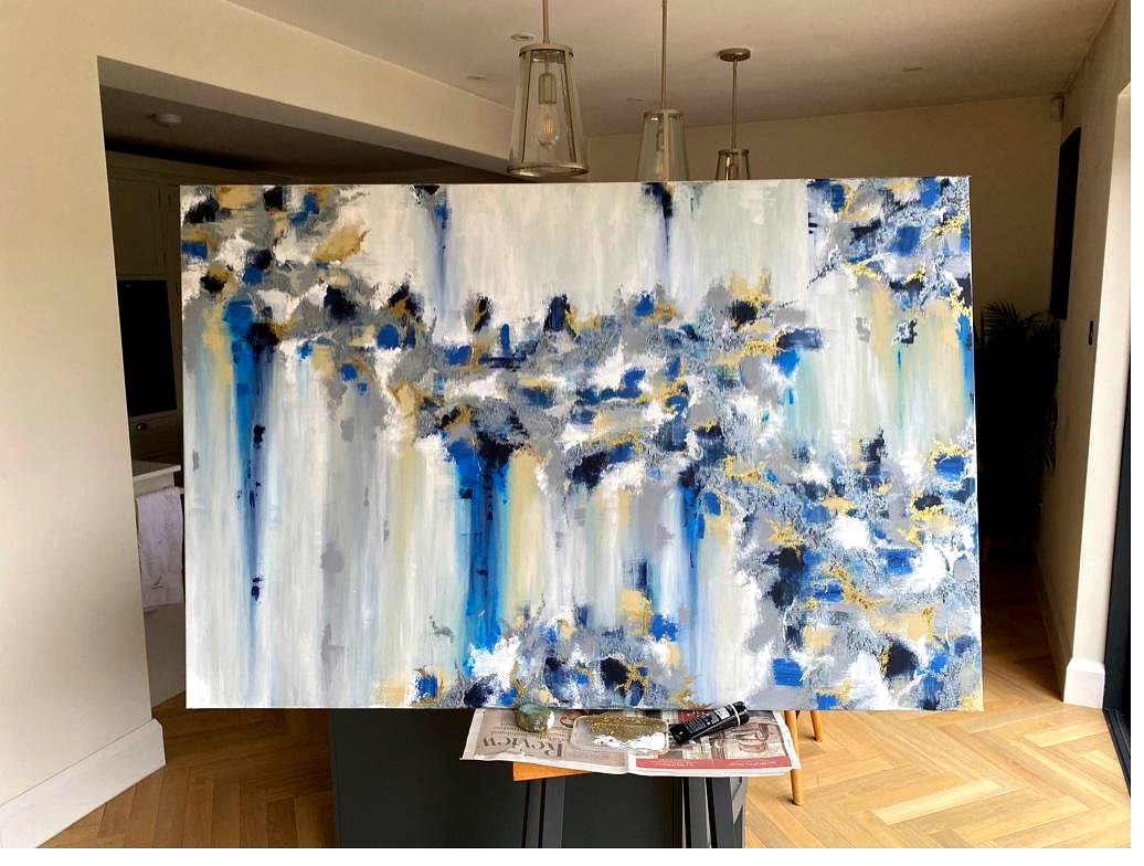 Blue and gold abstract on easel