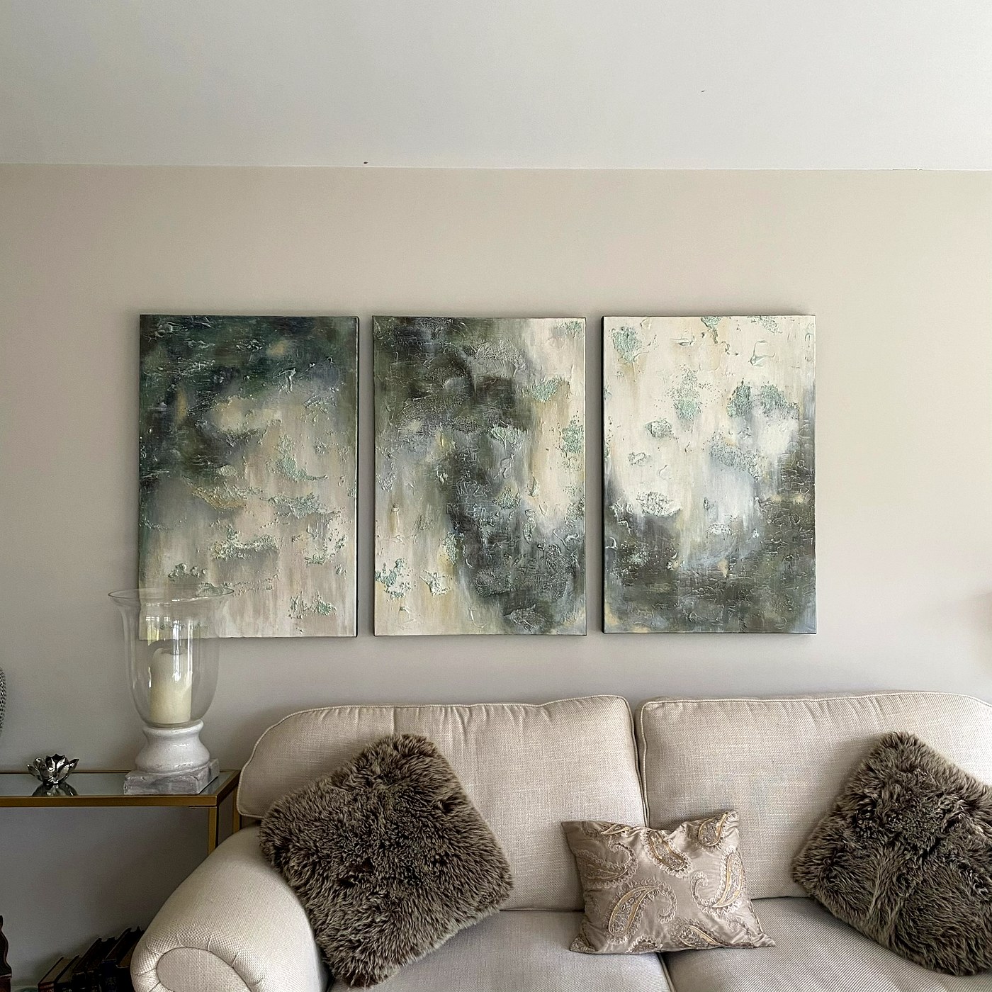 Green triptych in living room