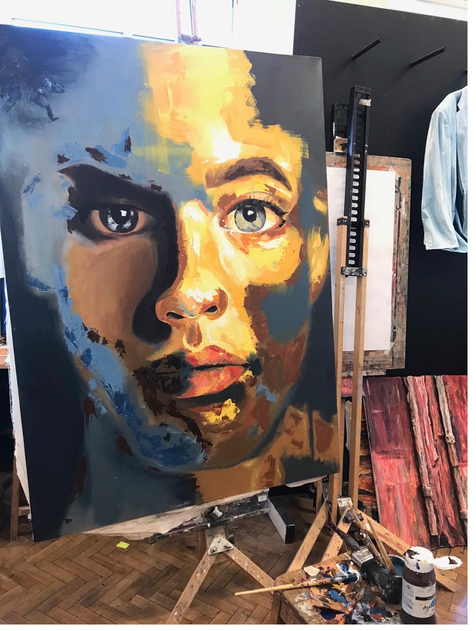 Sophie Mae painting in her studio